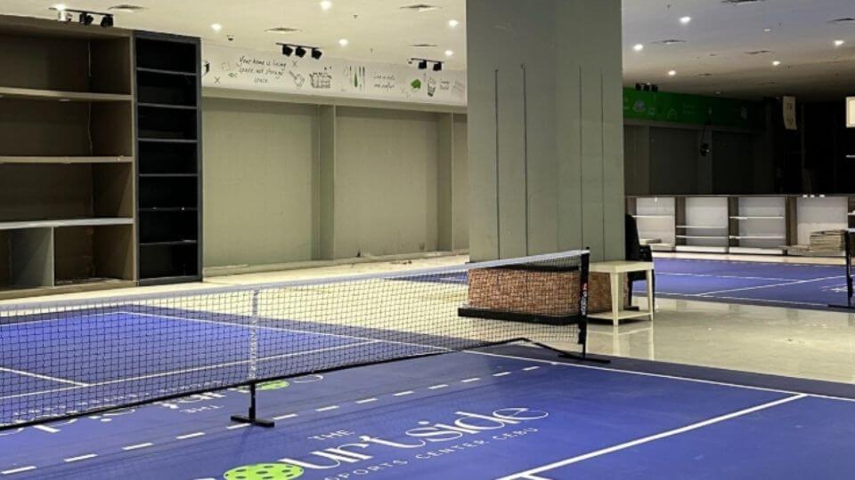 The Courtside Pickleball — indoor court and net